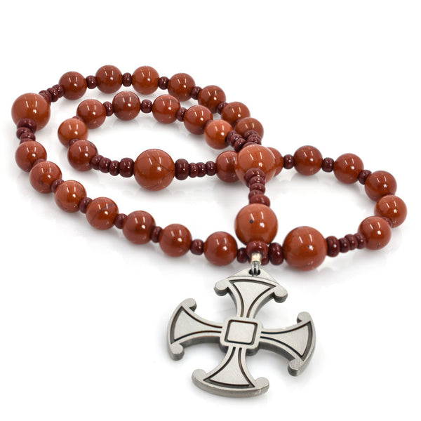 A string of round Red Jasper beads with a silver Celtic Canterbury cross pendant at the center.
